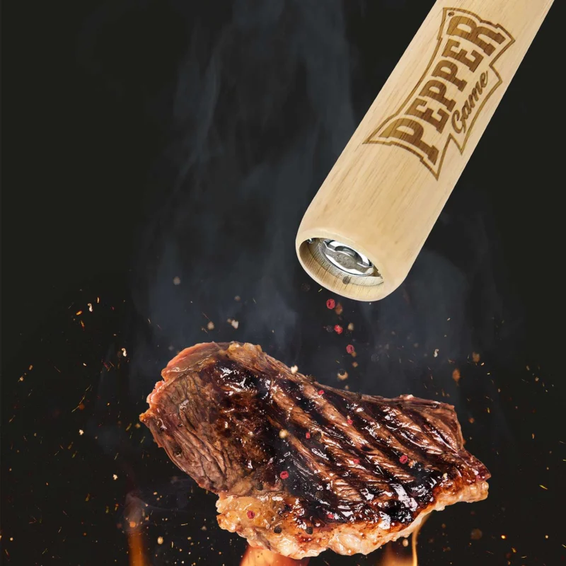 PEPPER GAME brand pepper mill, 71 cm tall, with a sleek black design and a stainless steel grinding mechanism.