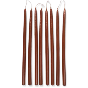 Spike Slim Candles in rust, set of 8 tapered candles laid in a row