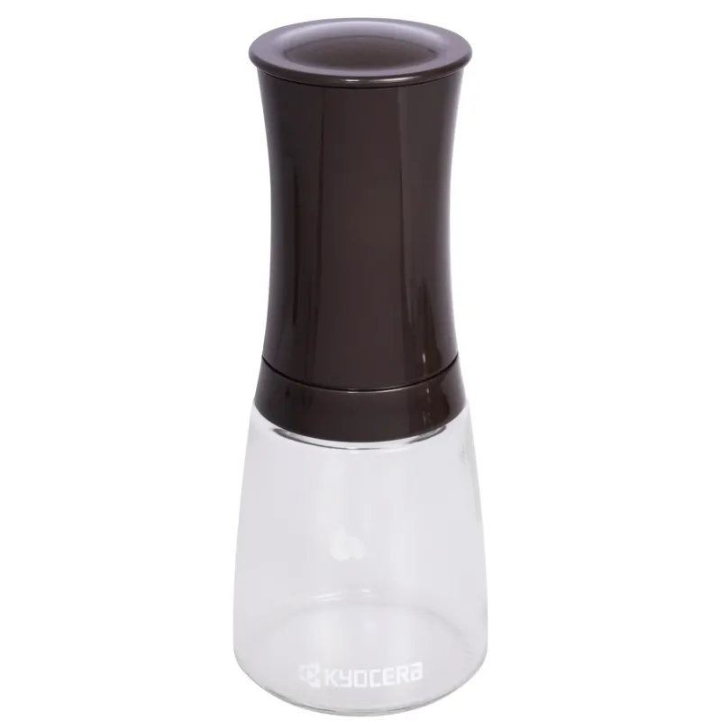 KYOCERA ceramic pepper grinder in dark brown, 16 cm tall, with textured ceramic grinding mechanism for fresh spice grinding.