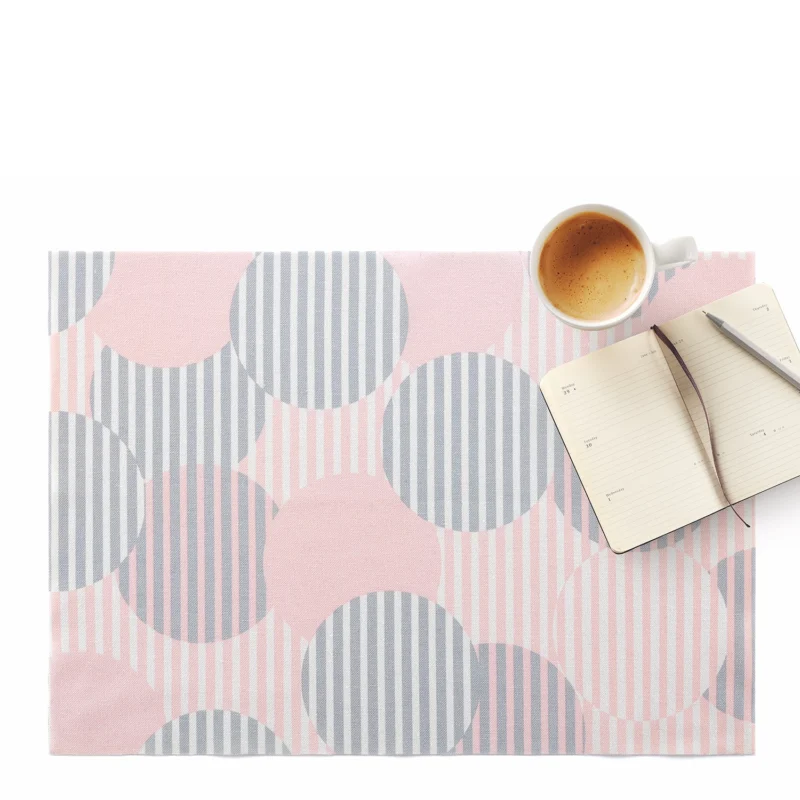 Pink polka dot table placemats with lotus effect from DAY DRAP, set of two, featuring a stylish design and water-repellent surface.