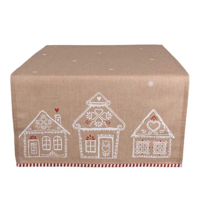 Eine beige Tischdecke von Clayre & Eef namens „Tischläufer Lebkuchenhäuser“, mit weiß-roten Dekormustern von drei Häusern auf der einen Seite.